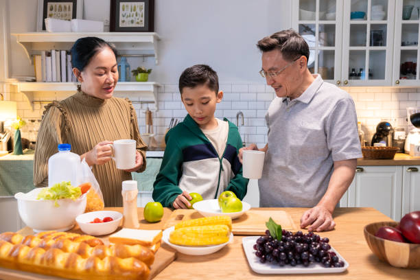 istock Parents teach their son to make a hearty breakfast 2182866403