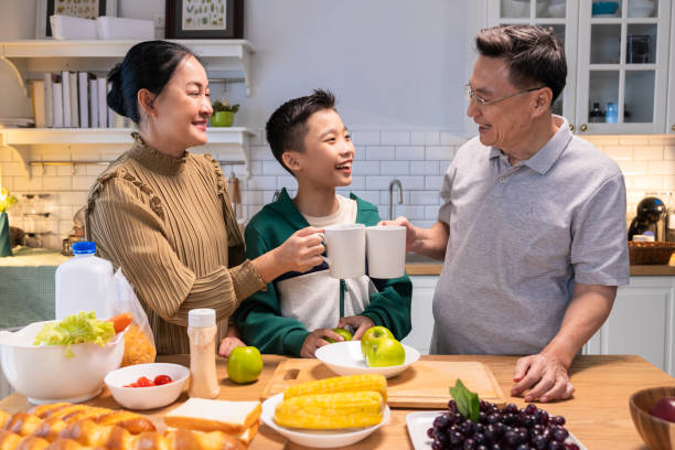 istock Parents teach their son to make a hearty breakfast 2182866902