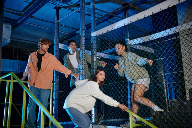 istock Young multicultural friends explore a thrilling quest room adventure filled with fun at night 2182868997