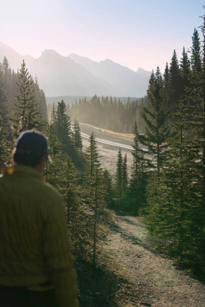 istock Mature man hikes through forest in autumn 2182870263
