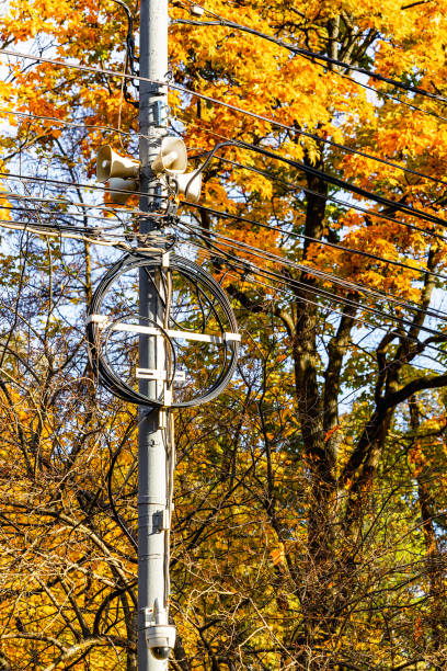 istock loudspeaker on street pole with wires, vertical photo 2182874464