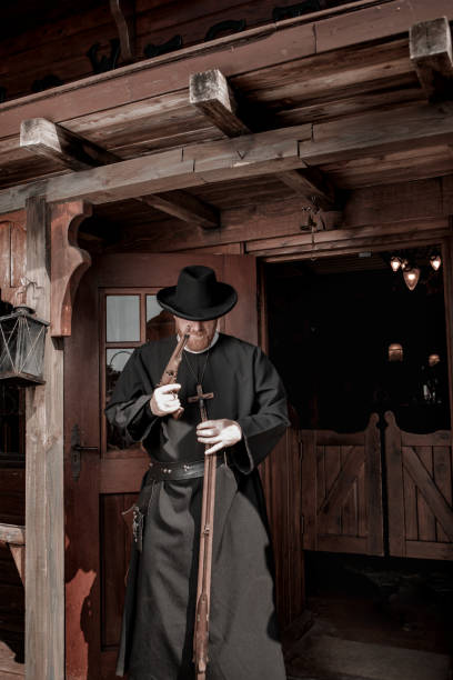 istock Handsome redhead Cowboy priest in an authentic wild west setting 2182874561