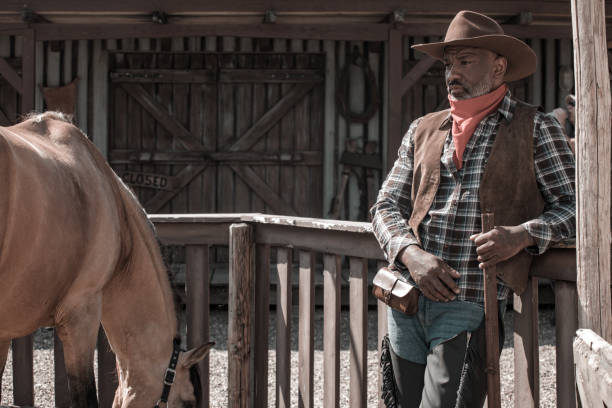 istock Handsome Black Cowboy in an authentic wild west setting 2182874746