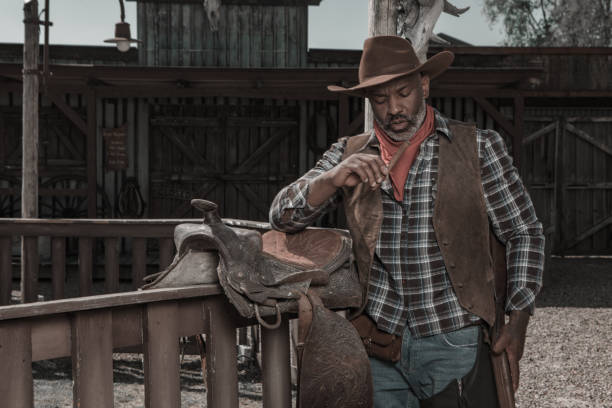 istock Handsome Black Cowboy in an authentic wild west setting 2182874972