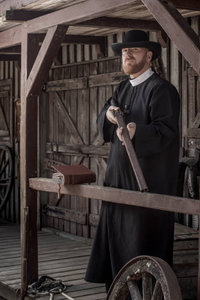 istock Handsome redhead Cowboy priest in an authentic wild west setting 2182875655