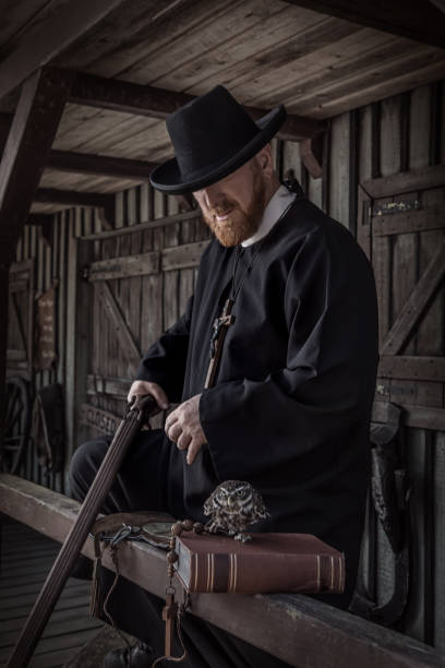 istock Handsome redhead Cowboy priest with an owl in an authentic wild west setting 2182875713