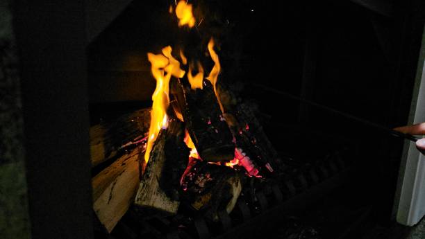 istock Warm glow of a crackling fire inside a cozy fireplace during a winter evening gathering 2182876683
