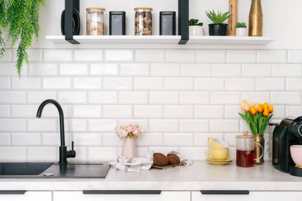 istock Kitchen space featuring elegant decor, sink and faucet close food and drinks 2182878346
