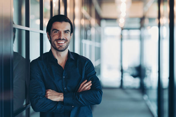 istock Smiling businessman in a modern office building 2182879370