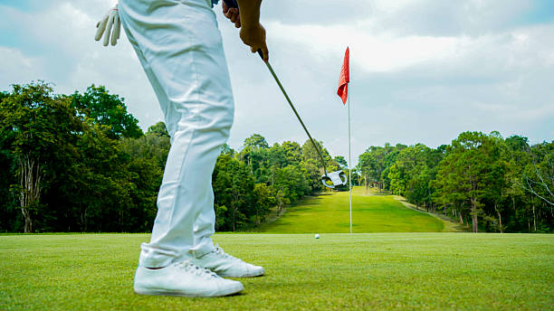 istock Blurred golfer playing golf in the evening golf course, on sun set evening time. 2182880642