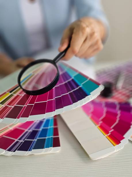 istock A designer examining color swatches with a magnifying glass for a project 2182881807