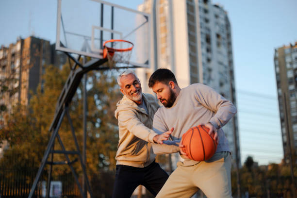 istock Father and son playing basketball outdoor 2182885774