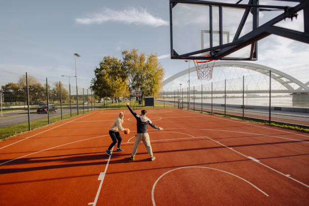 istock Father and son playing basketball outdoor 2182886521