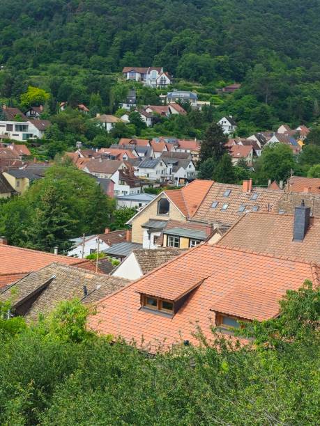 istock Charming hillside village with red-tiled rooftops and lush greenery 2182891443