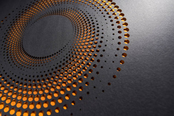 istock Circular paper cut design with glowing orange dot gradient on dark background, creating a warm, hypnotic effect. 2182892293