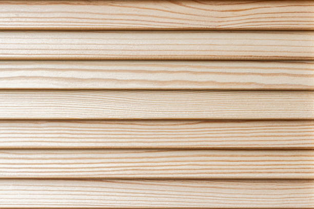 Horizontal wooden planks made of natural pine wood with a light beige color and a natural wood grain pattern