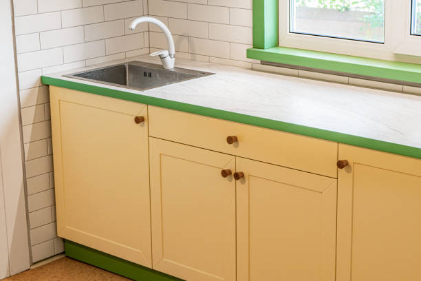 istock Modern kitchen design with yellow cabinets and marble countertop 2182892993