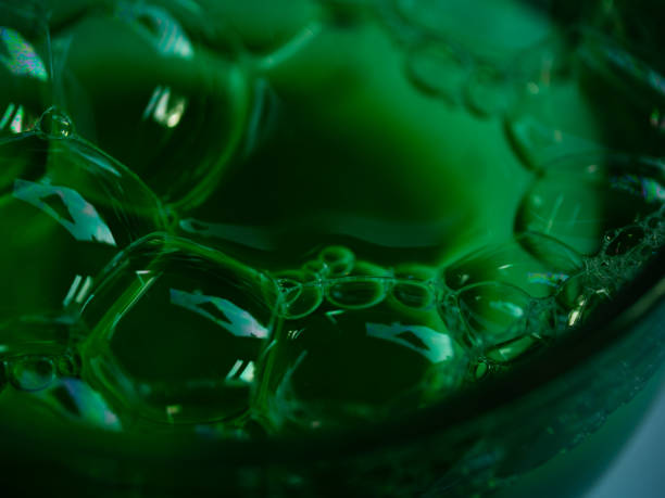 Green water bubbles close up macro shot selective focus