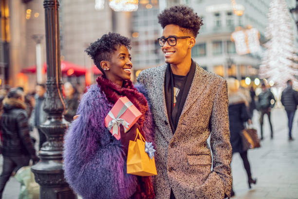 istock Young couple is opening a Christmas present 2182893867