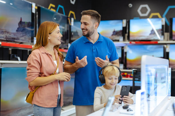 istock Family shopping for electronics at modern retail store 2182894127