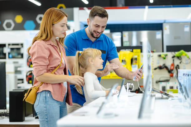 istock Mother and daughter exploring electronic devices in a modern retail store 2182895144