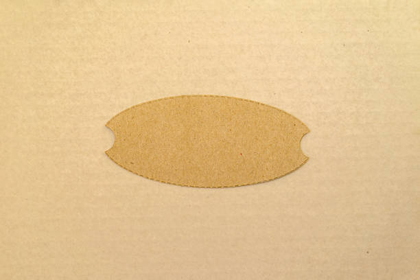 Simple oval Brown frame lies on a light paper surface. Natural background, copy space