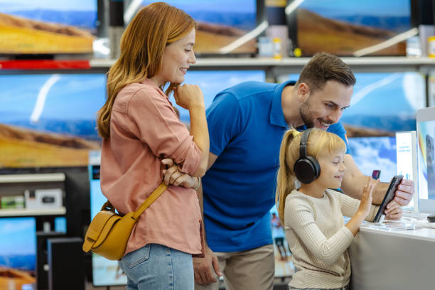istock A cheerful family explores the latest electronics at a store 2182895392