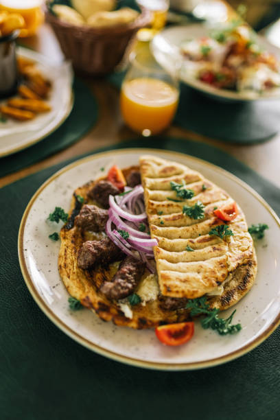 istock Traditional south european sausages cevapi being served in a restaurant. 2182895704