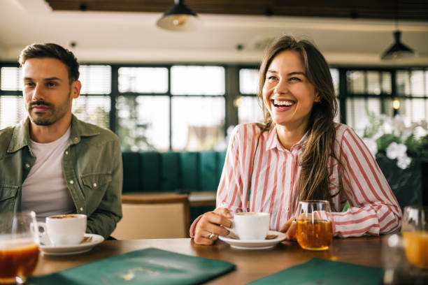 istock Happy friends drinking coffee in a restaurant. Hanging out and having fun together. 2182896385