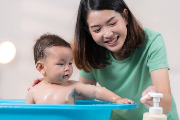 istock When mom gives the baby a bath, he enjoys it 2182897364