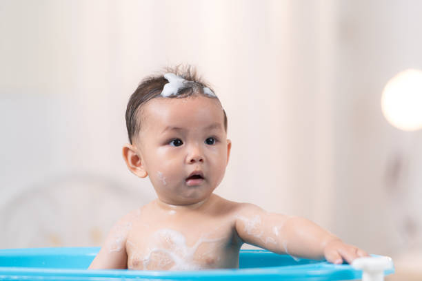 When mom gives the baby a bath, he enjoys it