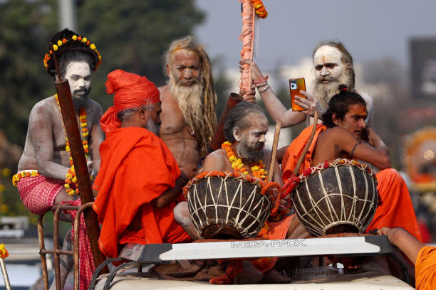 Sadhus(Holy Men) of Juna Akhara along with Kinner Akhara take part in a religious procession during the Nagar Pravesh ceremony(Entry in the City) for the upcoming Kumbh Mela festival 2025, in Prayagraj, India on Sunday.