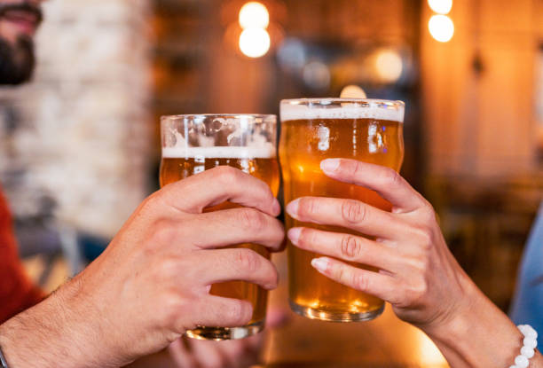 istock Couple making a toast in the pub 2182900022