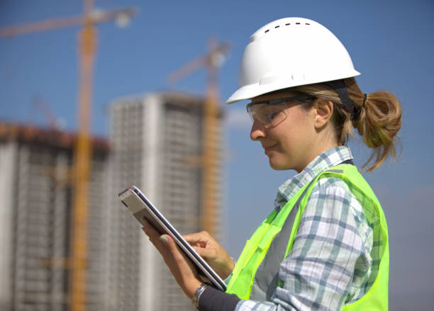 istock Female civil engineer checking her plans using a tablet at the construction site. 2182900276