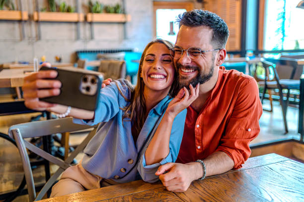 istock Couple taking selfies in the pub 2182900727