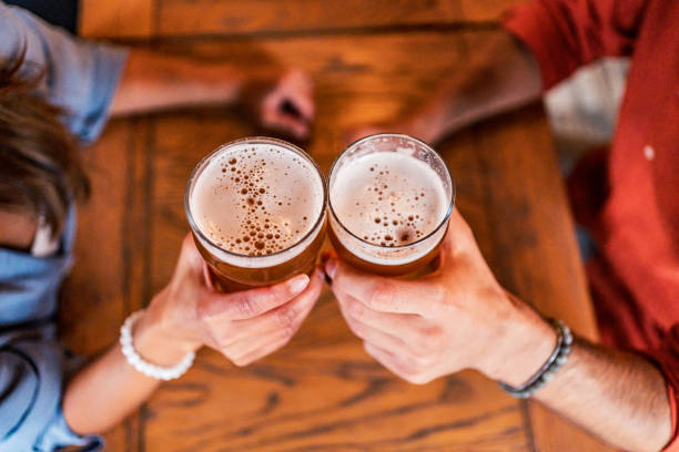 istock Couple making a toast in the pub 2182901138
