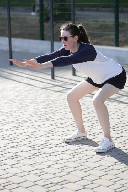 istock Woman exercising or doing workout session outside 2182903019
