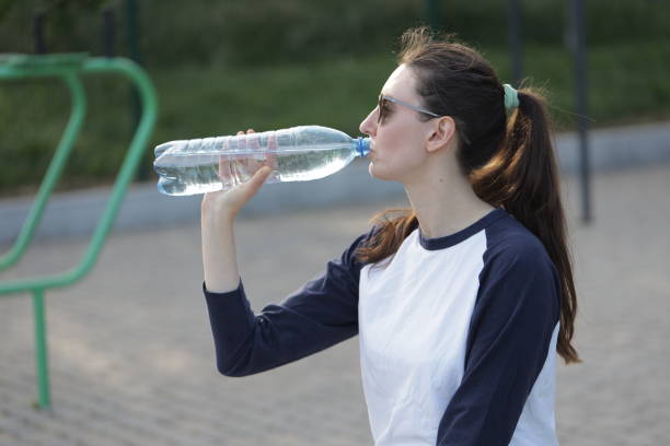 istock Woman exercising or doing workout session outside 2182905409