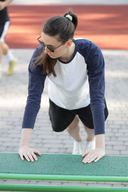 istock Woman exercising or doing workout session outside 2182907131