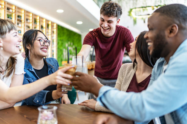 istock Happy young friends having fun in cafe 2182908169