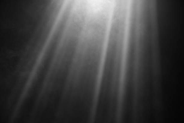 istock White and Gray Smoke Illuminated by Light Beams Against a Dark Background 2182908415