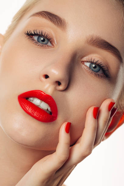 istock Young beautiful woman with red lips 2182914936