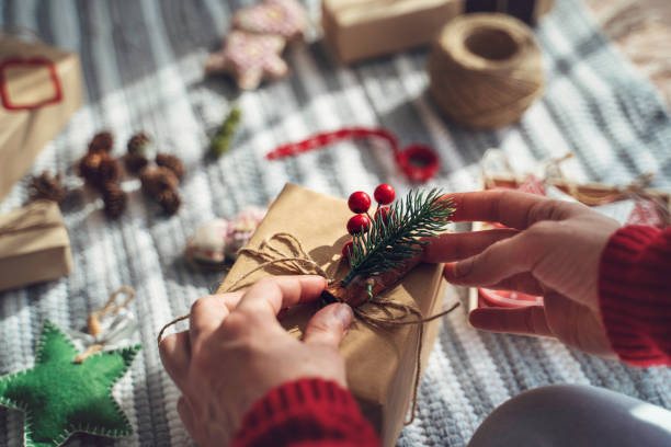 istock Artistic holiday gift wrapping with cozy ornaments. 2182915270