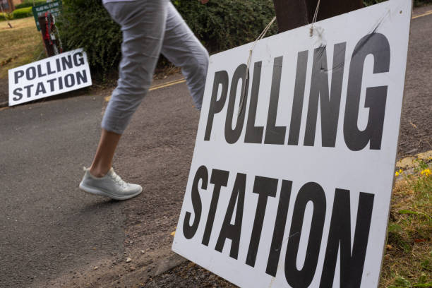 istock Voter Voting at a Polling Station in UK Election 2182916178