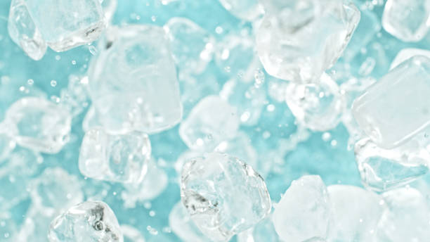 istock Freeze motion of flying ice cubes isolated on blue background. 2182919780