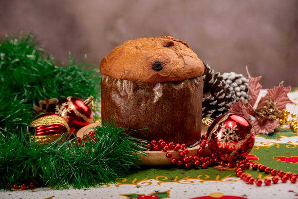 istock Christmas table with panettone, beautiful table decorated with Christmas objects and a delicious panettone, selective focus. 2182920984