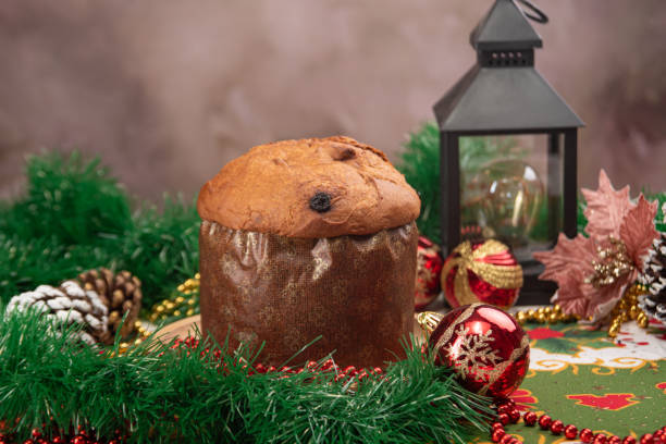 istock Christmas table with panettone, beautiful table decorated with Christmas objects and a delicious panettone, selective focus. 2182921078