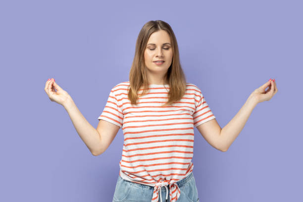 istock Woman relaxing and doing meditation gesture with fingers, practicing yoga. 2182925933