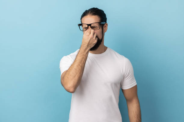 istock Man touching closed eyes, crying from depression, grief or pain, feeling hopeless. 2182926113