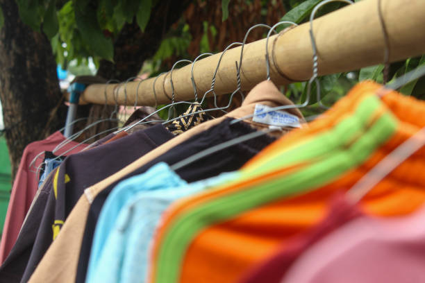 close up of clothes hanger hanging on bamboo pole